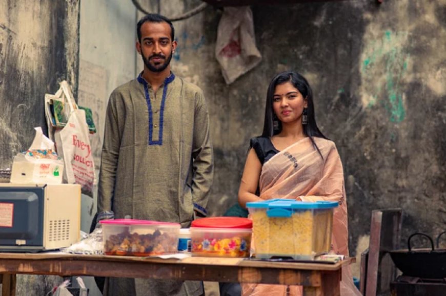 These two students of BRAC were sitting near the campus with mother's cooking khichdi